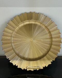 a gold plate on a black surface