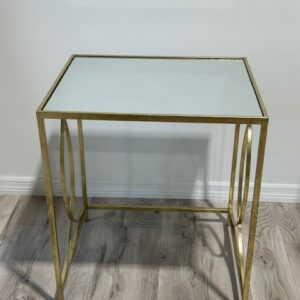 a glass table on a wood floor