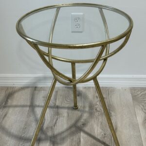 a round glass table with legs